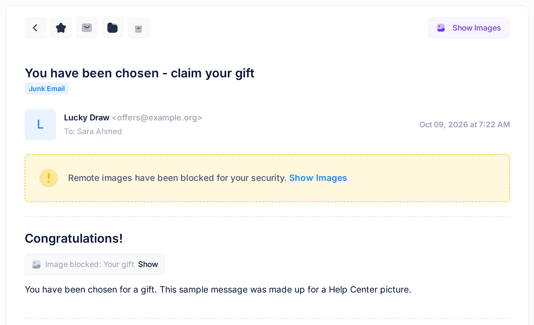 A message in the Junk Email folder: a yellow notice says that remote images have been blocked, with the link Show Images, and in the text a grey box reads Image blocked: Your gift with the link Show.